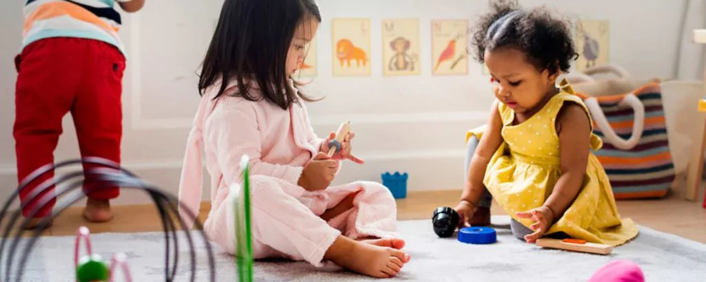 Children playing together in quality child care environment