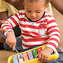 Baby playing with xylophone toy